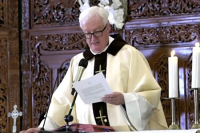 Fr. M&iacute;ċe&aacute;l O'Neill reading the Popes letter